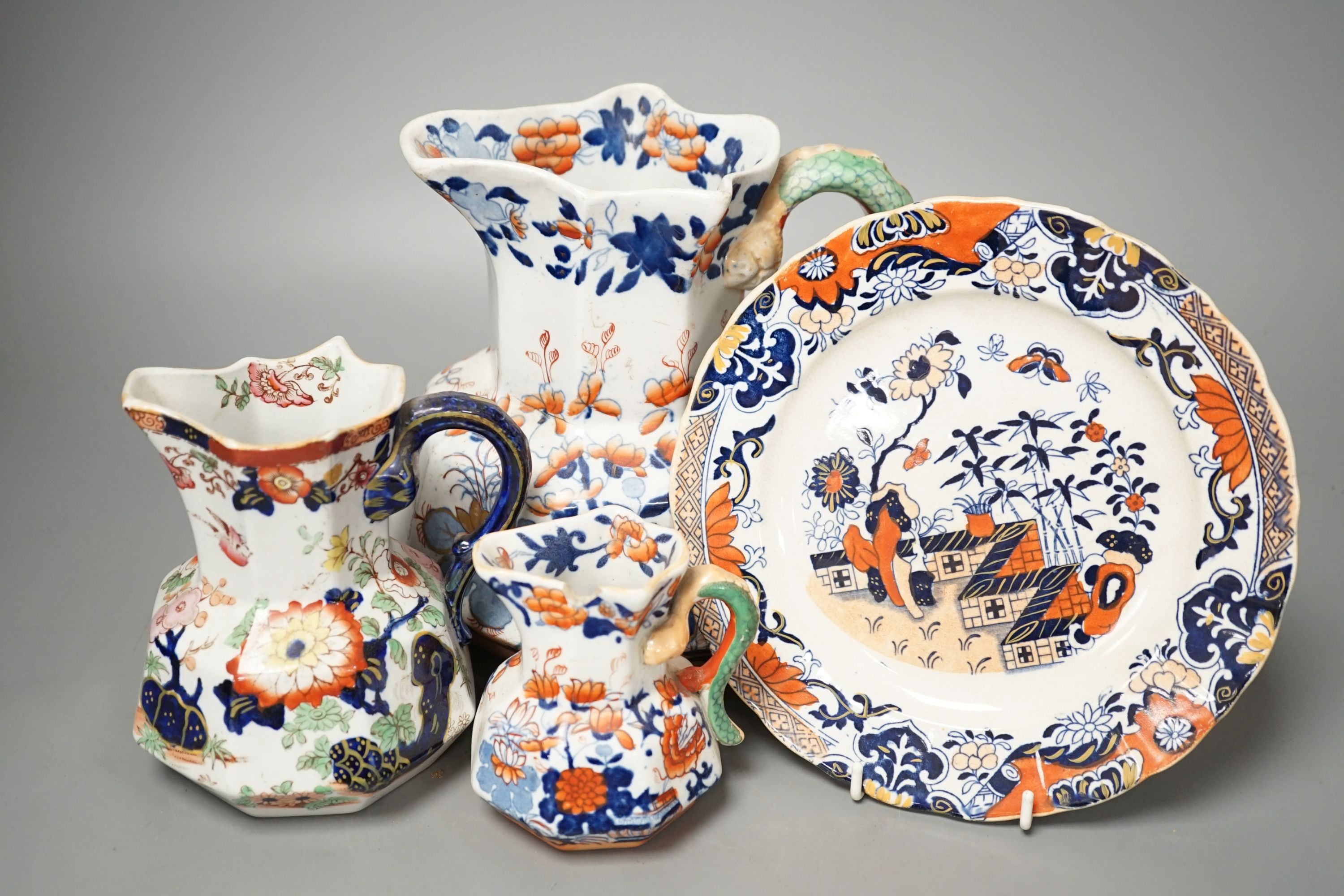 Four graduated Mason’s hydra jugs, tallest 19cm., and eight various ironstone or earthenware plates